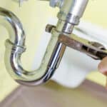 plumber repairing drain
